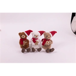 IRIS textil medve ülő, mikulás sapkában, mézeskalács süteménnyel a kézben,   18 cm